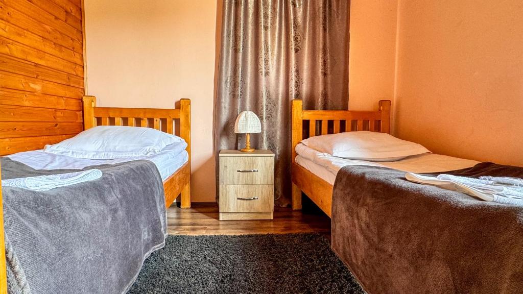 Postel nebo postele na pokoji v ubytování Cottage Gudauri