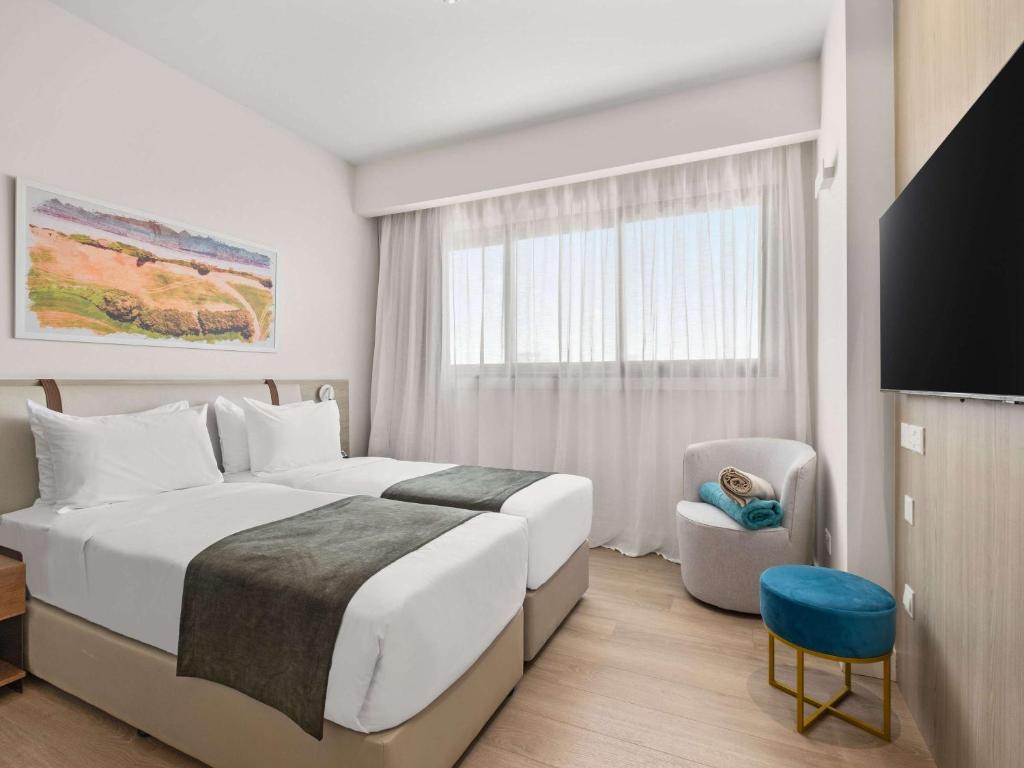 Postel nebo postele na pokoji v ubytování Mercure Larnaca City