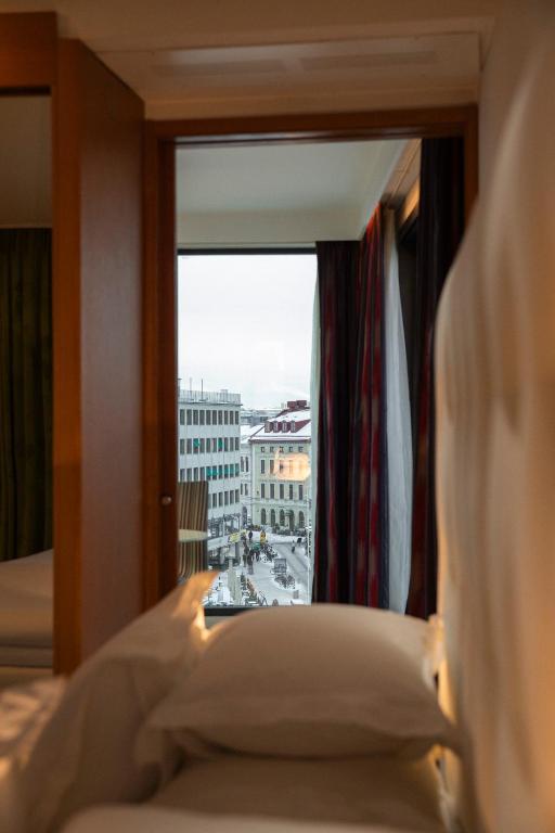 Postel nebo postele na pokoji v ubytování Avalon Hotel