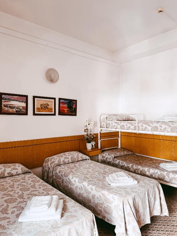 Postel nebo postele na pokoji v ubytování Hotel Paglierani - Nuova gestione 2024