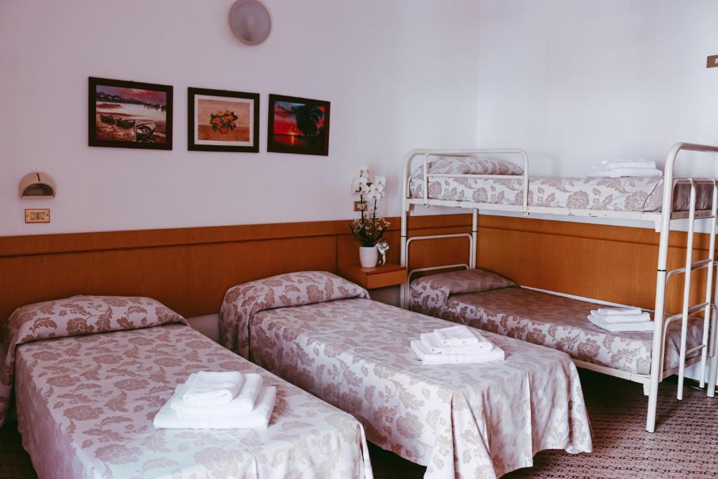 Postel nebo postele na pokoji v ubytování Hotel Paglierani - Nuova gestione 2024