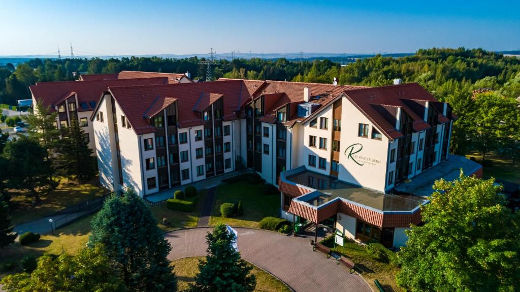 an aerial view of a building with a clock on it at RESIDENZ AM BERG in Hartmannsdorf