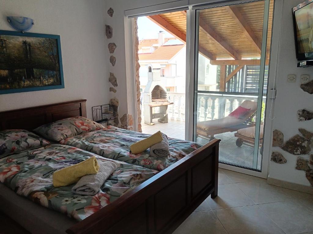 Postel nebo postele na pokoji v ubytování Apartments Moreta