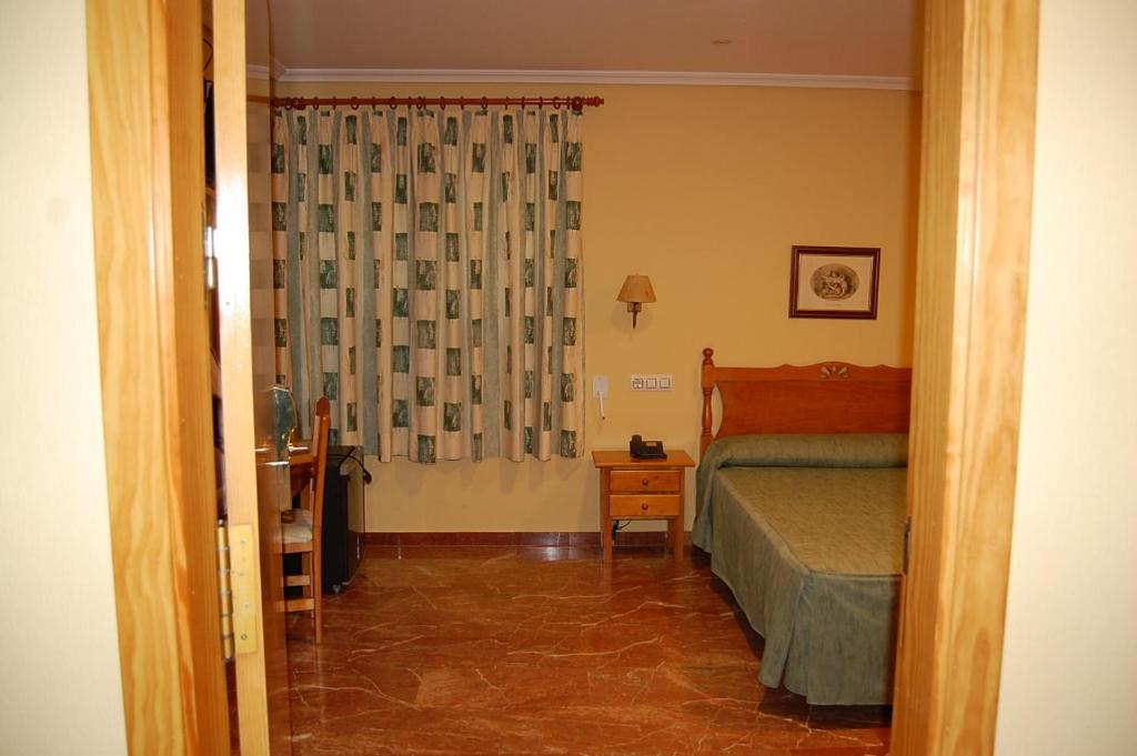 Postel nebo postele na pokoji v ubytování Hotel Albohera Playa