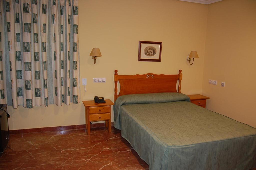 Postel nebo postele na pokoji v ubytování Hotel Albohera Playa