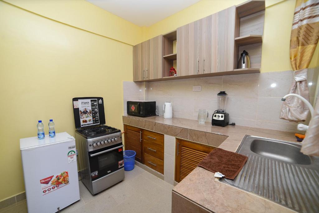 Kuchyň nebo kuchyňský kout v ubytování MAXIMILIAN HOMES