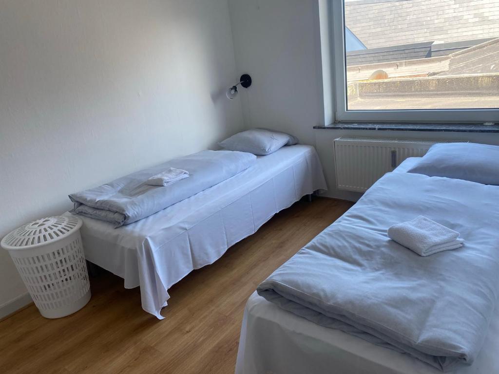 Postel nebo postele na pokoji v ubytování Hvide Sande Hotel