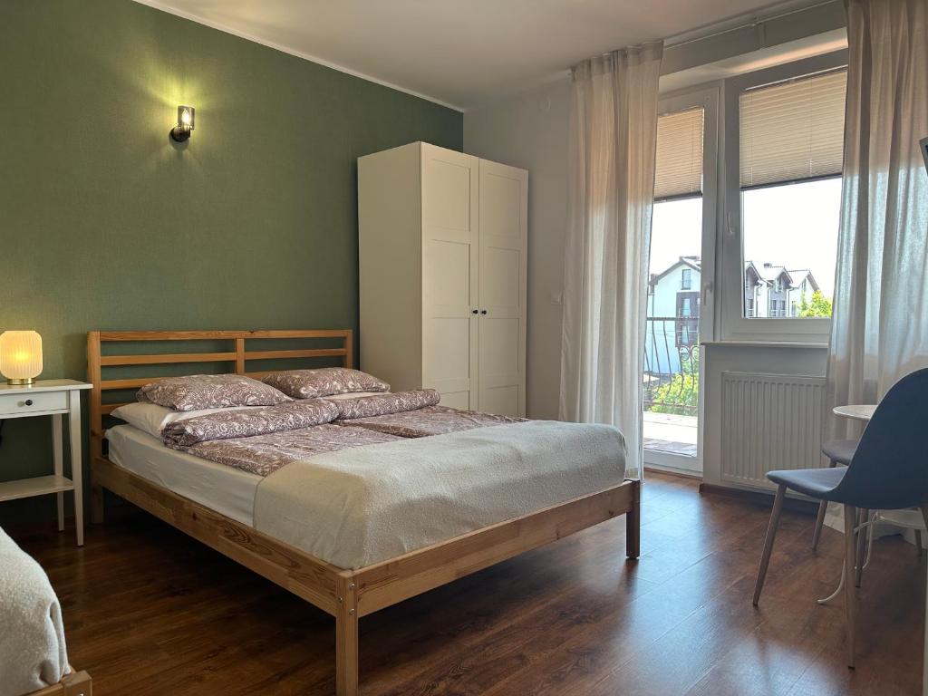 Llit o llits en una habitació de Pokoje Gościnne Beatka