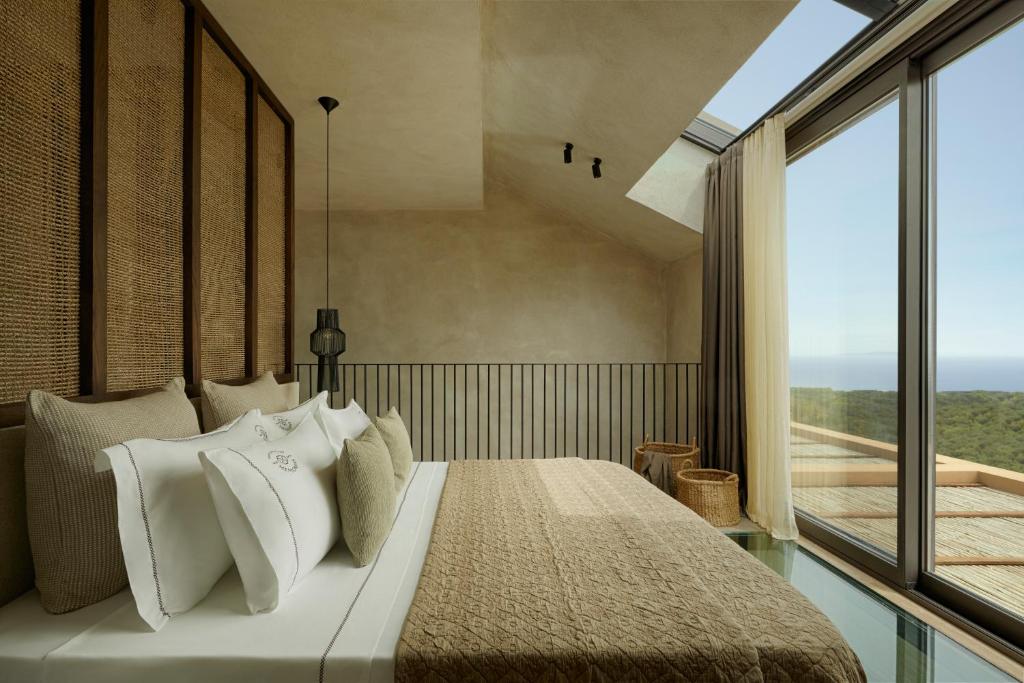 Postel nebo postele na pokoji v ubytování Memorias Suites and Villa