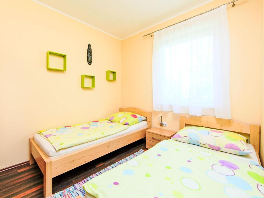 Posteľ alebo postele v izbe v ubytovaní Apartment Beige by Interhome