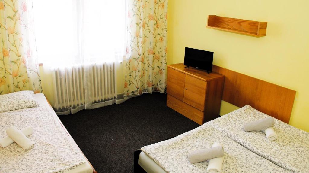 Postel nebo postele na pokoji v ubytování Star Hotels Benecko
