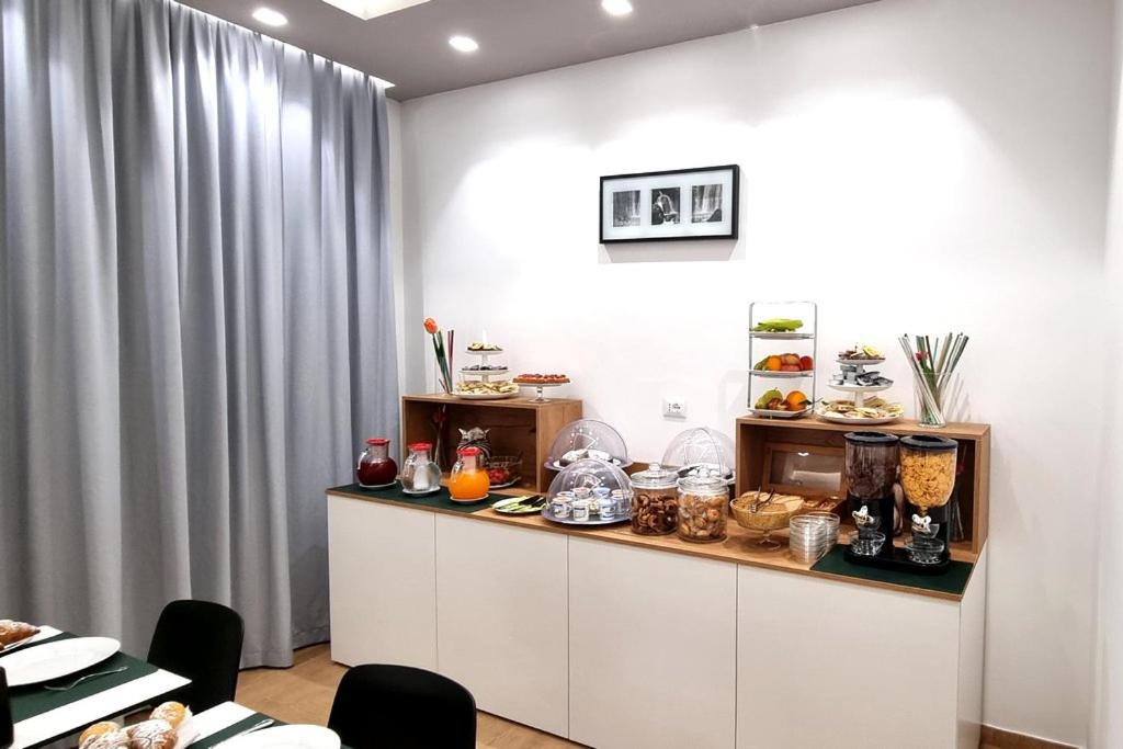 a kitchen with a counter with food on it at Room & Breakfast Aloe in San Vito lo Capo