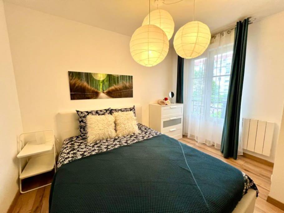 Ένα ή περισσότερα κρεβάτια σε δωμάτιο στο Appartement en centre-ville
