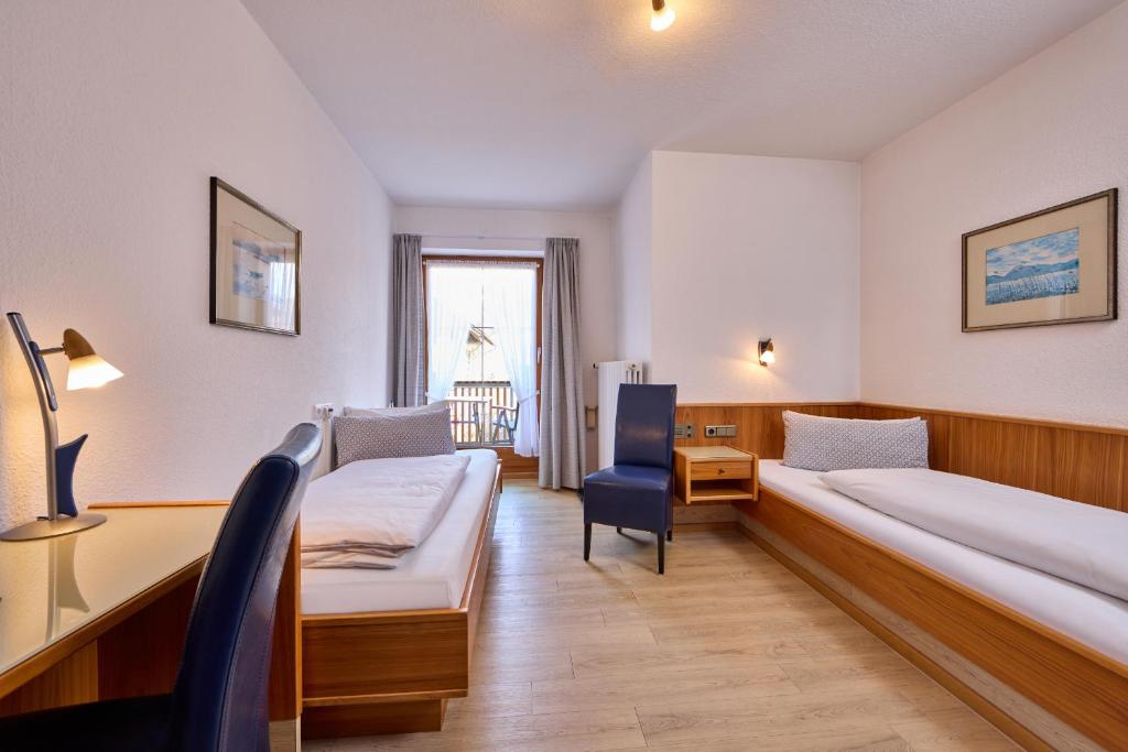 Postel nebo postele na pokoji v ubytování Hotel Antonia