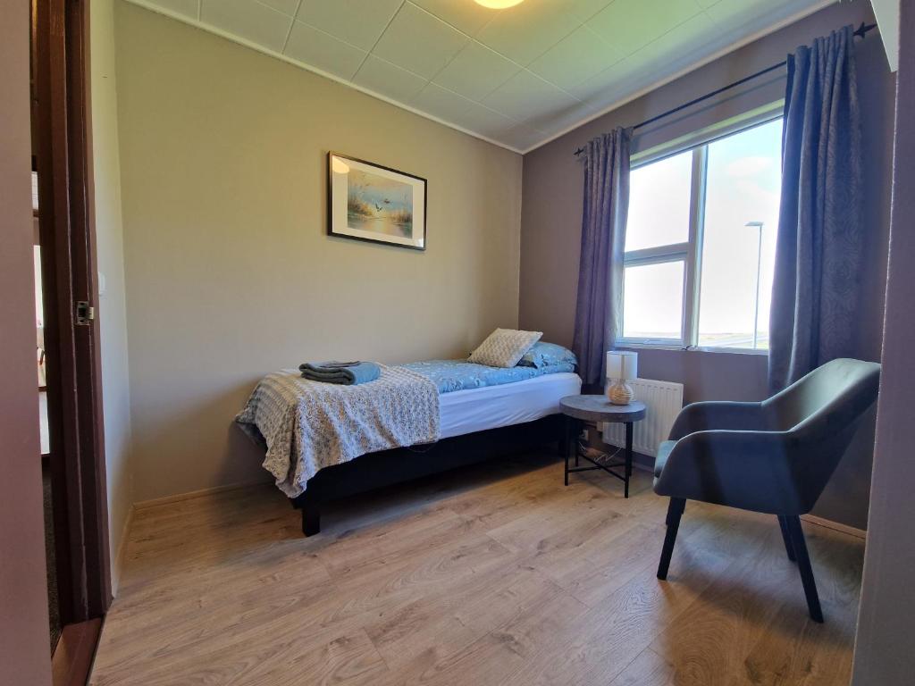 Postel nebo postele na pokoji v ubytování Helgafell Guesthouse