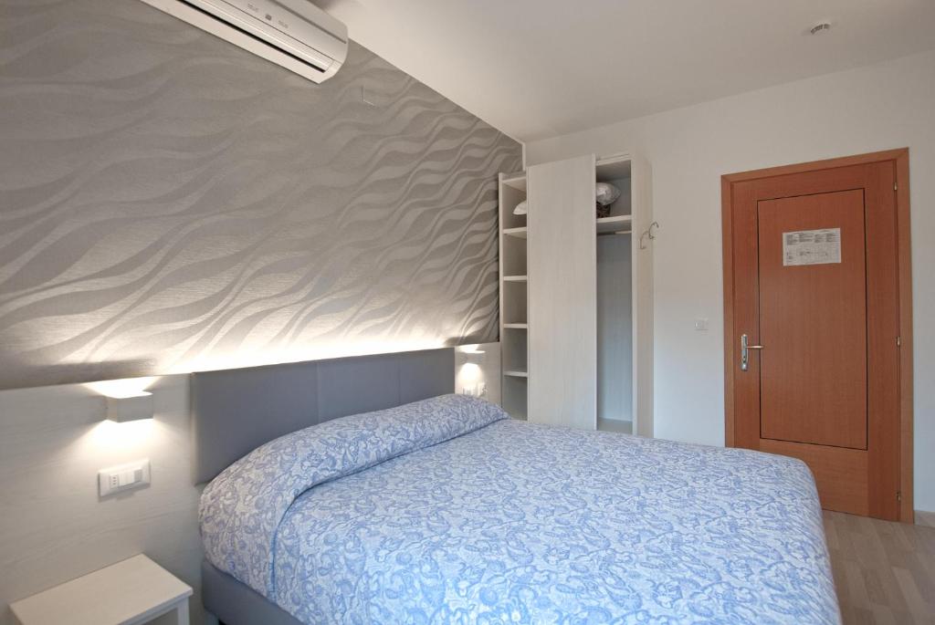 Postel nebo postele na pokoji v ubytování Hotel Paris