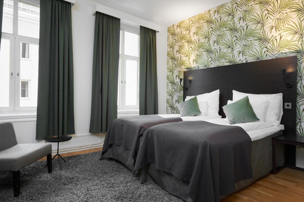 Postel nebo postele na pokoji v ubytování Home Hotel Plaza