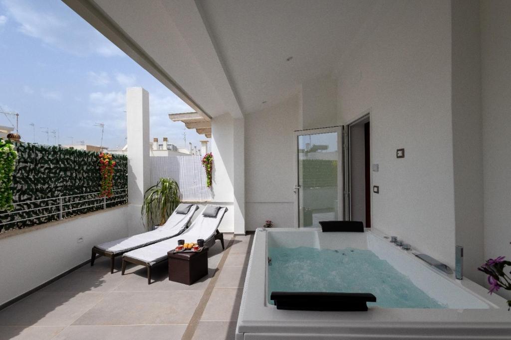 a swimming pool on the roof of a house at Le Suite di Magda Relax & Rooms in Polignano a Mare