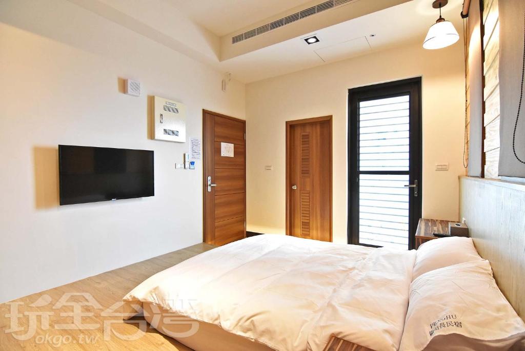Postel nebo postele na pokoji v ubytování Captain Ou Homestay