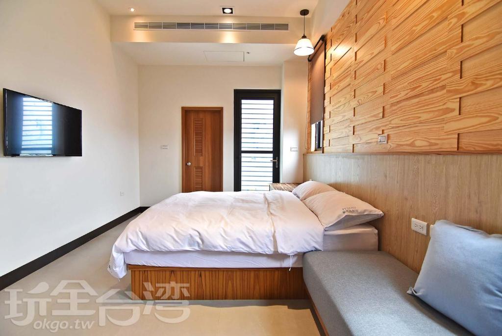 Postel nebo postele na pokoji v ubytování Captain Ou Homestay