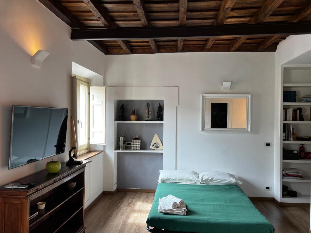 A television and/or entertainment centre at Colosseo Suite