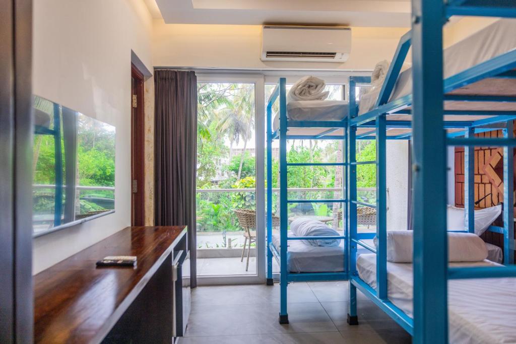 Postel nebo postele na pokoji v ubytování DownTown Hostels - Anjuna