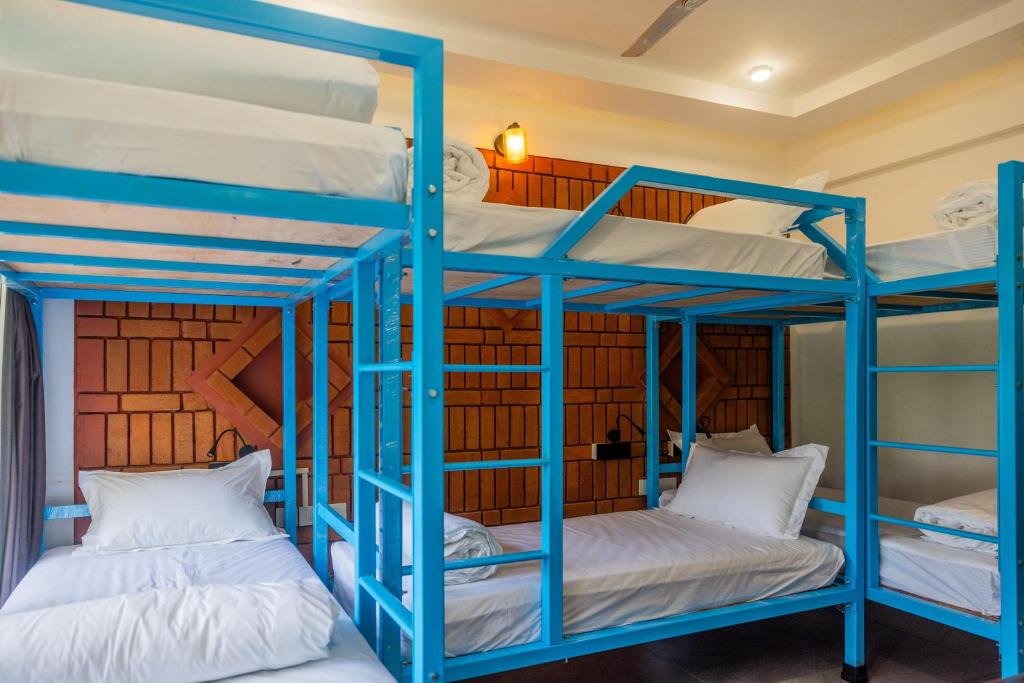 Postel nebo postele na pokoji v ubytování DownTown Hostels - Anjuna