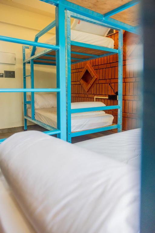 Postel nebo postele na pokoji v ubytování DownTown Hostels - Anjuna