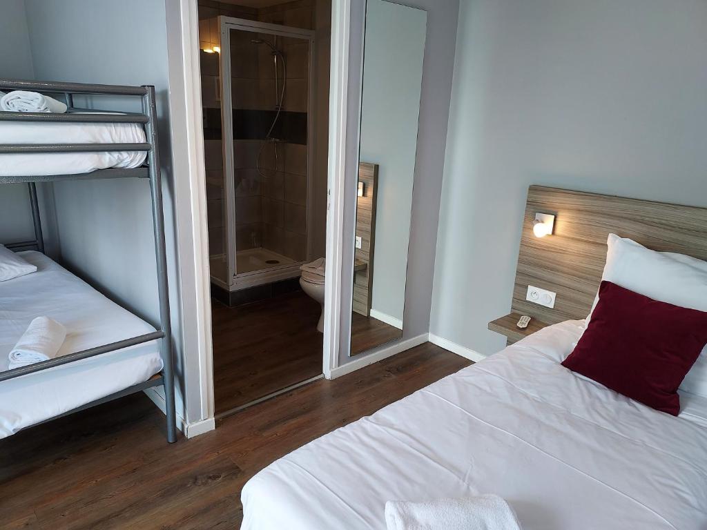 Postel nebo postele na pokoji v ubytování Hotel Eisenhower