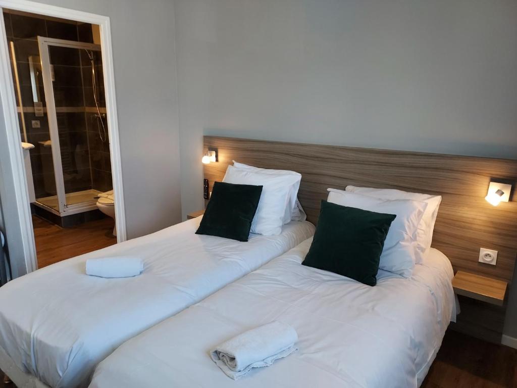 Postel nebo postele na pokoji v ubytování Hotel Eisenhower
