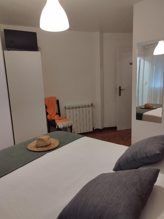 Postel nebo postele na pokoji v ubytování Aconchego do Lar