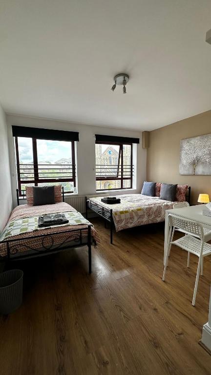 Ένα ή περισσότερα κρεβάτια σε δωμάτιο στο Portobello Guest Rooms