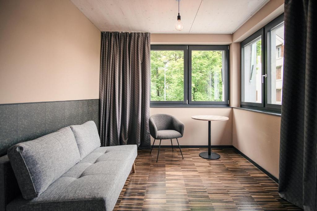 Posezení v ubytování Hota Hotel Saint-Imier