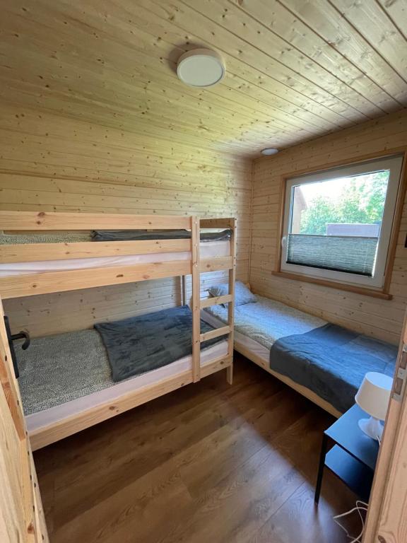 Postel nebo postele na pokoji v ubytování Domki letniskowe Babie Doły