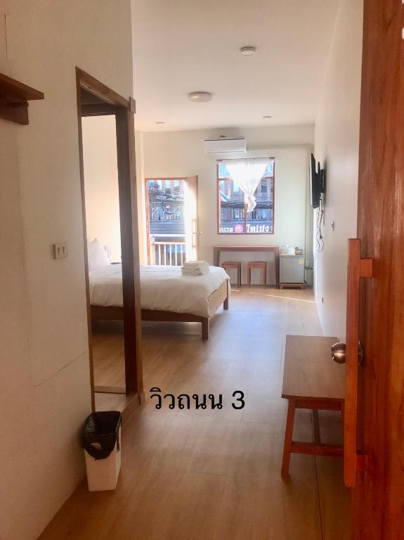Postel nebo postele na pokoji v ubytování นา-ใบบุญ Nabaiboon