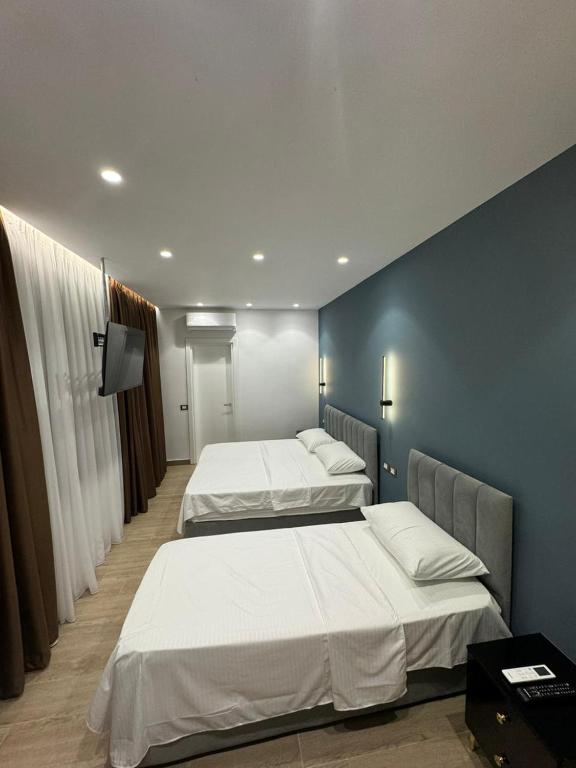 Postel nebo postele na pokoji v ubytování Sea La Vie Hotel