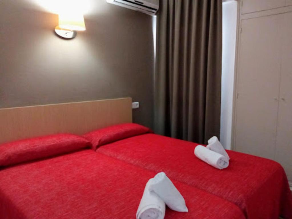 Postel nebo postele na pokoji v ubytování Apartamentos Orvay