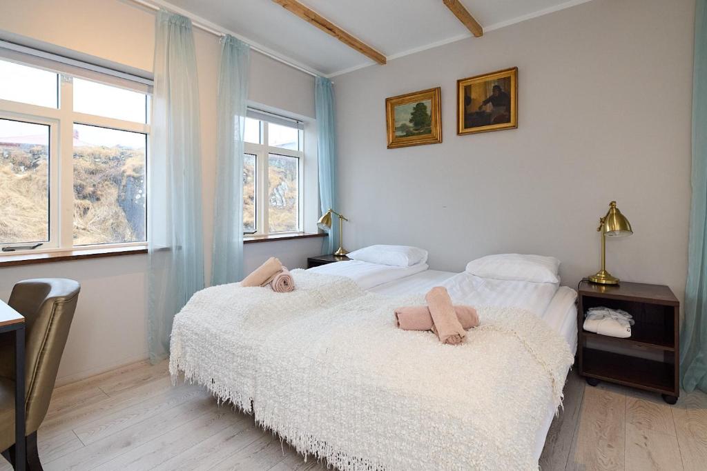 Postel nebo postele na pokoji v ubytování Englendingavík Homestay