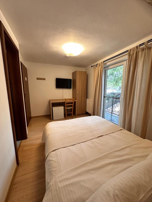 Voodi või voodid majutusasutuse Casa Dani toas