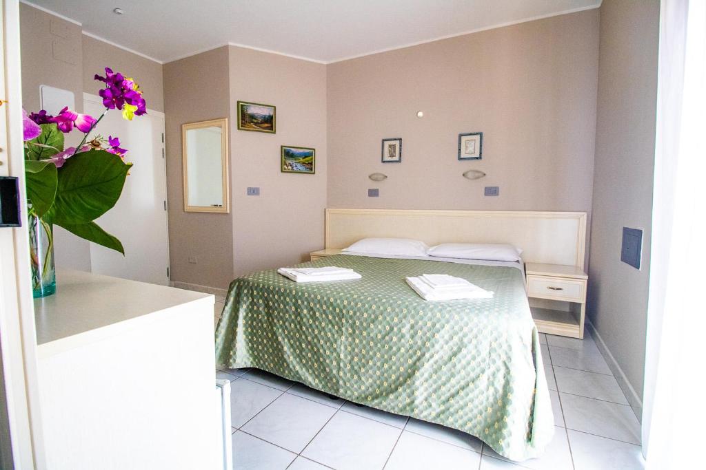 Postel nebo postele na pokoji v ubytování Di Matteo Hotel