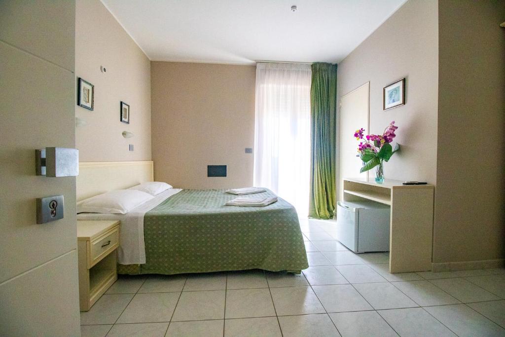 Postel nebo postele na pokoji v ubytování Di Matteo Hotel