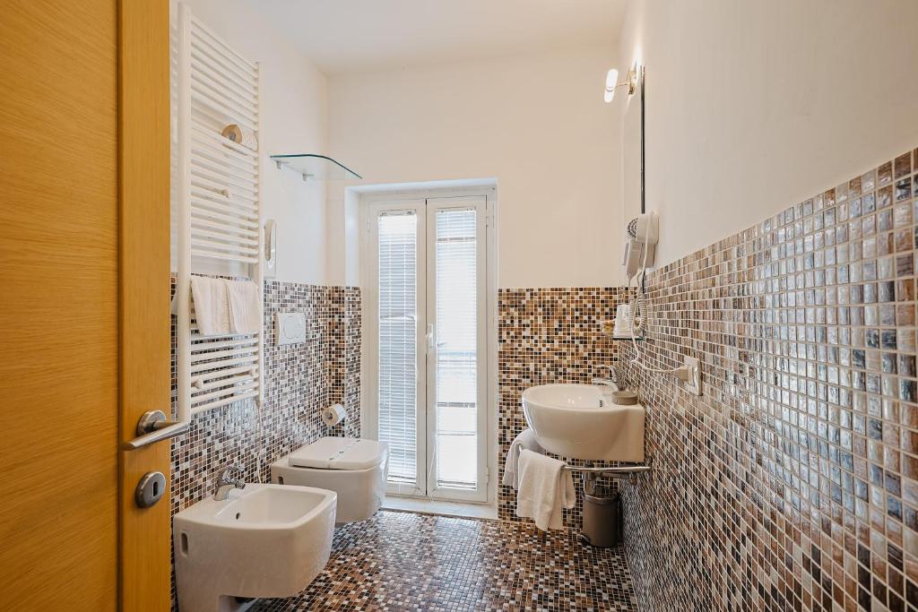 Koupelna v ubytování Bi Hotel