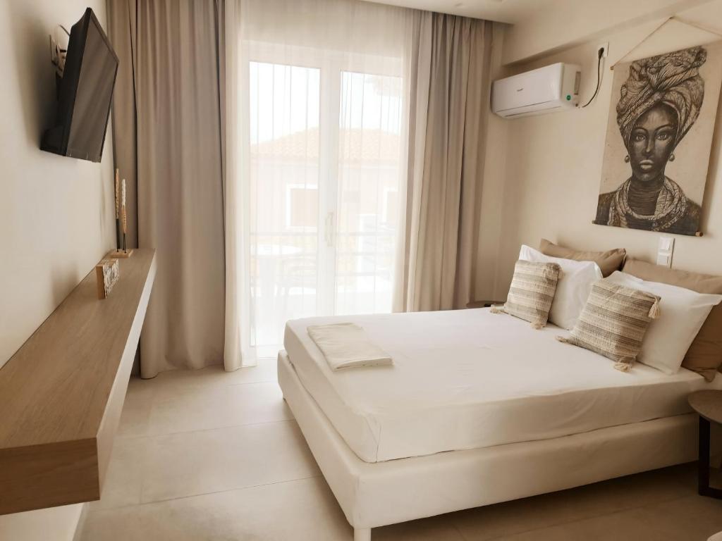 Ένα ή περισσότερα κρεβάτια σε δωμάτιο στο Akrogiali