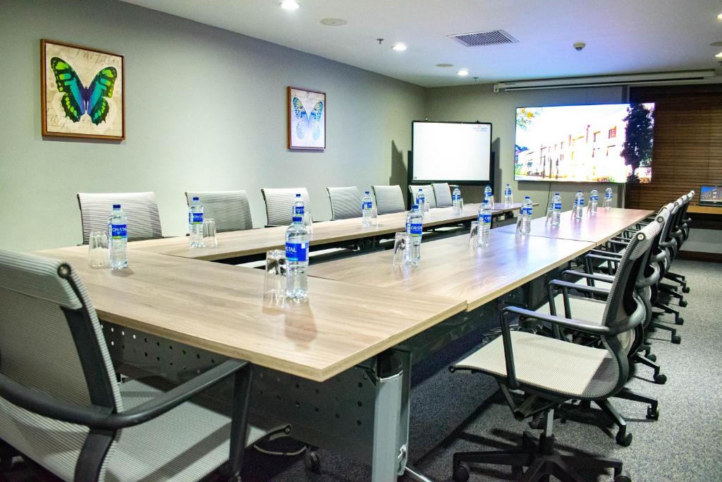 a large conference room with a long table and chairs at Hotel Habitel Select in Bogotá