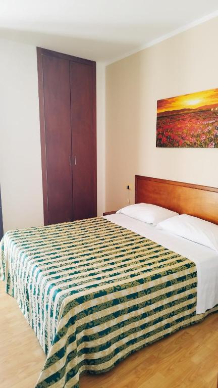 Postel nebo postele na pokoji v ubytování Hotel Nicolaj