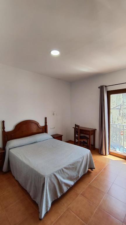 Posteľ alebo postele v izbe v ubytovaní Hostal Jadraza