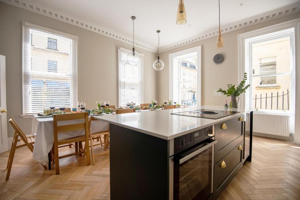 a kitchen with a large island and a dining room at Dream Stays Bath - Barton House in Bath