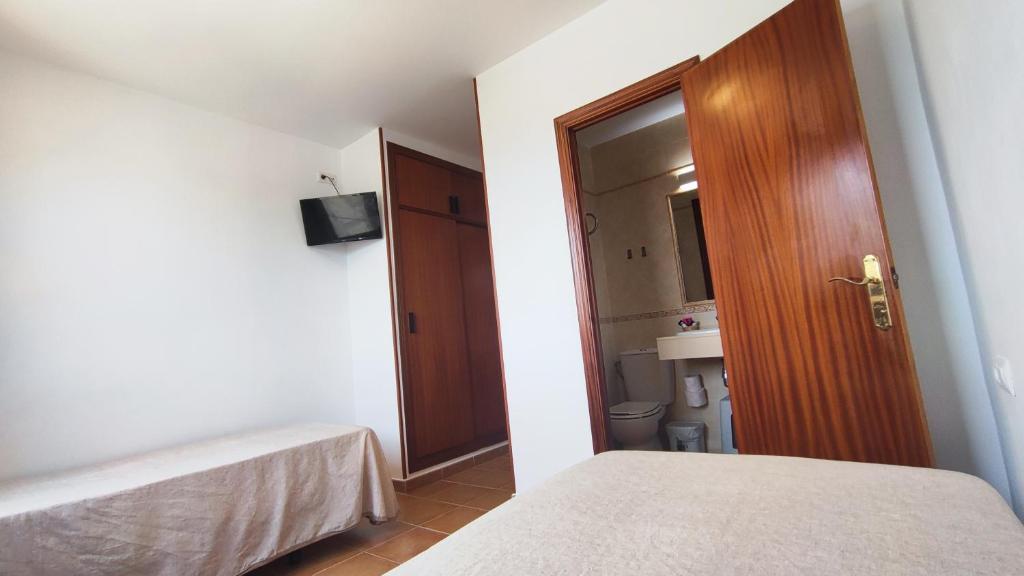 Posteľ alebo postele v izbe v ubytovaní Hostal Jadraza