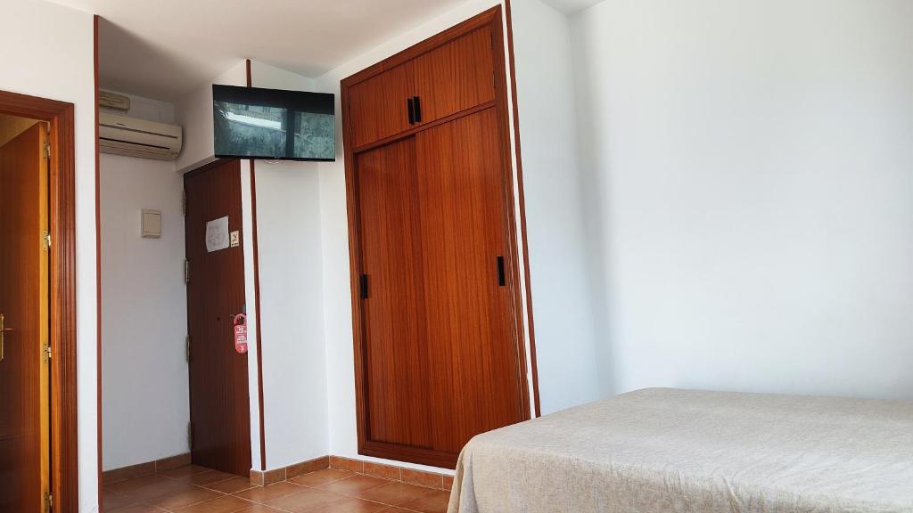 Posteľ alebo postele v izbe v ubytovaní Hostal Jadraza