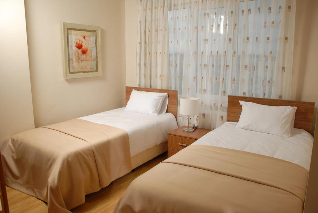 Postel nebo postele na pokoji v ubytování Airport Residence